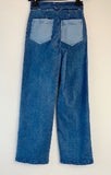 Jeans bicolor apertura